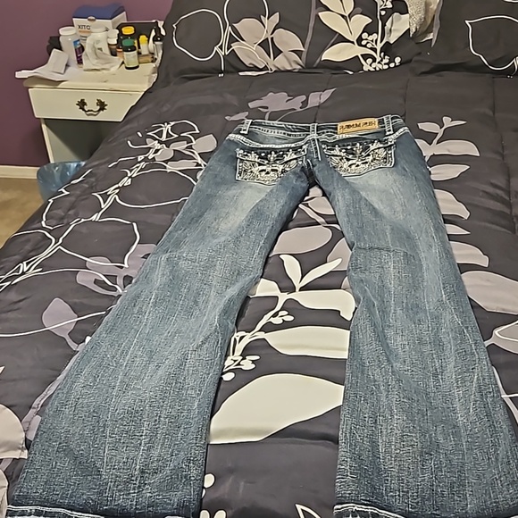 A pair of boot-cut  Platinum Plush jeans - Picture 7 of 11